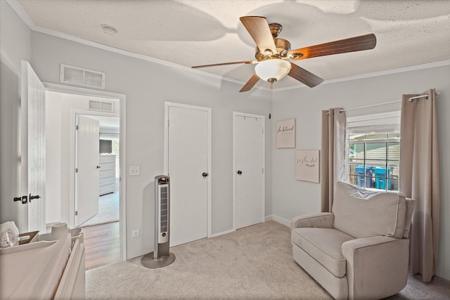 510 W Rhodes St, Thomasboro, IL 61878 - living area with crown molding, carpet floors, and a ceiling fan