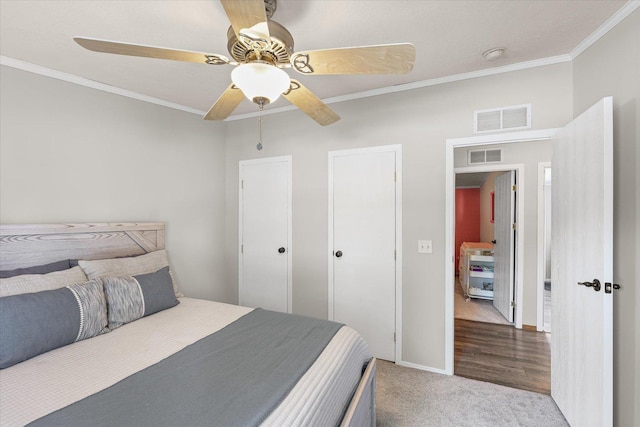 510 W Rhodes St, Thomasboro, IL 61878 - carpeted bedroom with ornamental molding and a ceiling fan