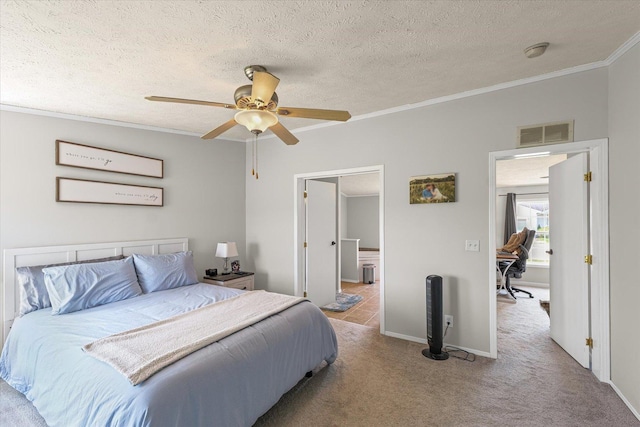 510 W Rhodes St, Thomasboro, IL 61878 - carpeted bedroom featuring ornamental molding, a ceiling fan, a textured ceiling, and ensuite bath