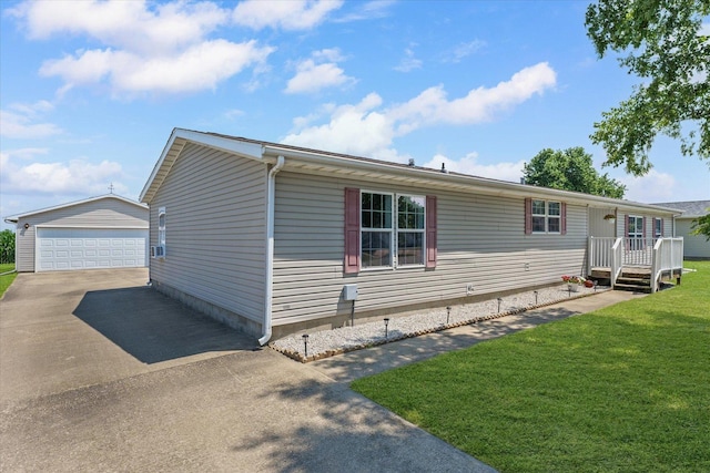 510 W Rhodes St, Thomasboro, IL 61878 - view of front of home featuring a garage, an outdoor structure, and a front yard