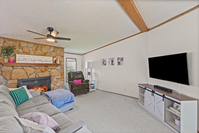510 W Rhodes St, Thomasboro, IL 61878 - carpeted living area featuring ornamental molding, vaulted ceiling, a fireplace, a ceiling fan, and a textured ceiling