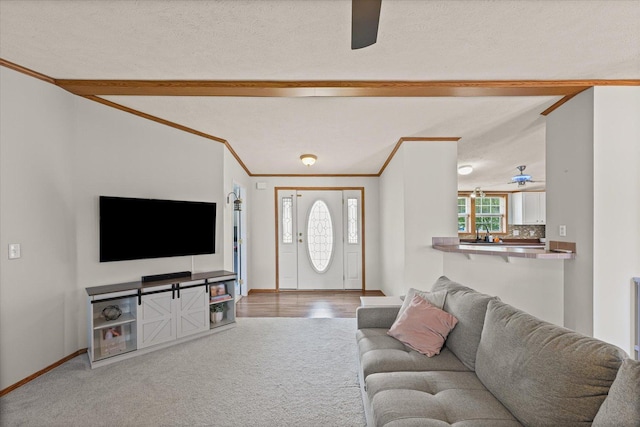 510 W Rhodes St, Thomasboro, IL 61878 - living room with ceiling fan, carpet, beam ceiling, and crown molding