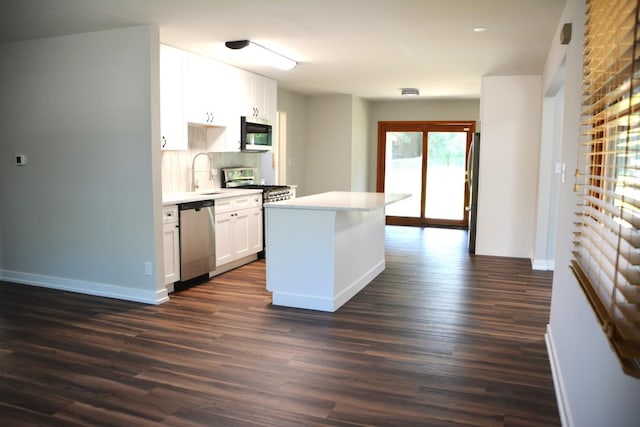 2811 Limerick Dr, Cary, IL 60013 - kitchen featuring appliances with stainless steel finishes, dark wood-type flooring, decorative backsplash, white cabinetry, and recessed lighting