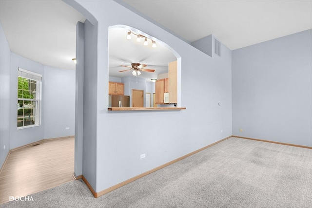 1422 Citadel Dr Unit 0, Joliet, IL 60435 - unfurnished room with arched walkways, ceiling fan, and light carpet