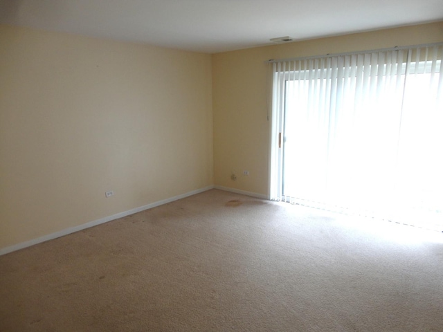 9703 Bianco Ter Unit B, Des Plaines, IL 60016 - spare room featuring carpet floors and baseboards