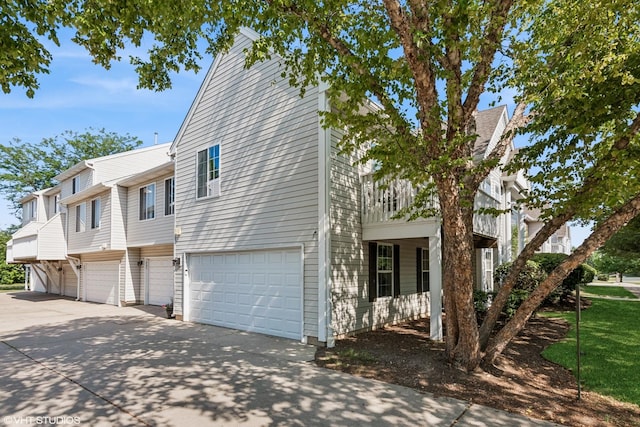 201 Hidden Creek Ln Unit 201, North Aurora, IL 60542 - view of property exterior with driveway and an attached garage