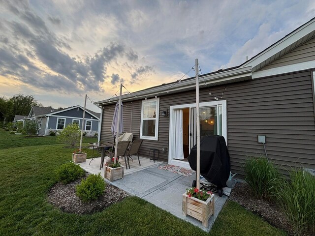 1135 Williamsburg St, Pingree Grove, IL 60140 - rear view of property featuring a lawn and a patio