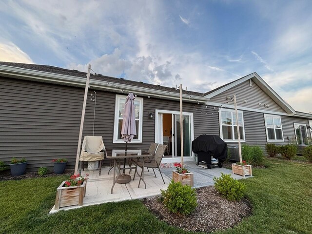 1135 Williamsburg St, Pingree Grove, IL 60140 - back of property featuring a lawn and a patio area