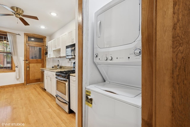 622 W Waveland Ave Unit 2W, Chicago, IL 60613 - washroom featuring stacked washing machine and dryer, light wood-style floors, recessed lighting, and ceiling fan