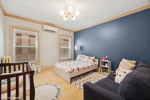 622 W Waveland Ave Unit 2W, Chicago, IL 60613 - bedroom with a wall unit AC, a chandelier, ornamental molding, wood finished floors, and multiple windows
