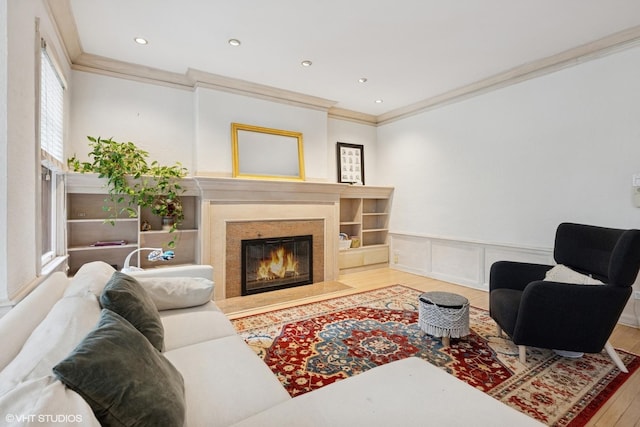 622 W Waveland Ave Unit 2W, Chicago, IL 60613 - living room featuring ornamental molding, wood finished floors, a fireplace, recessed lighting, and a wainscoted wall