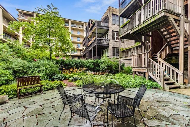 622 W Waveland Ave Unit 2W, Chicago, IL 60613 - view of patio / terrace featuring stairway and outdoor dining space