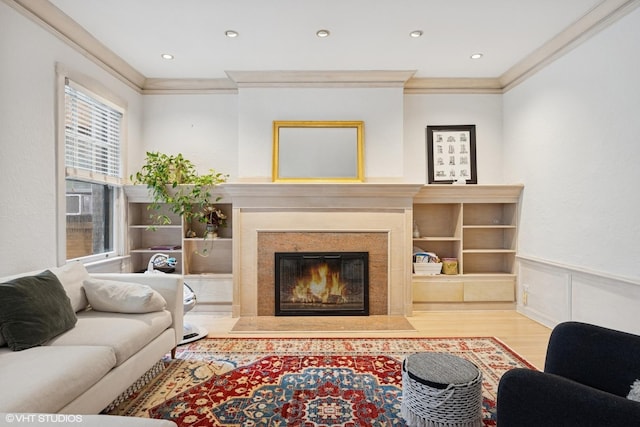 622 W Waveland Ave Unit 2W, Chicago, IL 60613 - living room with ornamental molding, wood finished floors, a wainscoted wall, a premium fireplace, and recessed lighting