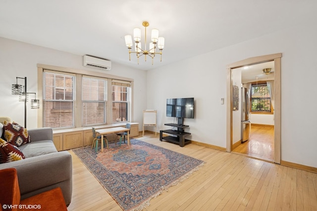 622 W Waveland Ave Unit 2W, Chicago, IL 60613 - living area with an AC wall unit, a chandelier, and light wood-style flooring