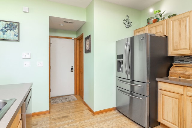 3707 Bowie Ct, Joliet, IL 60435 - kitchen featuring stainless steel appliances, light brown cabinetry, light wood-style flooring, and backsplash