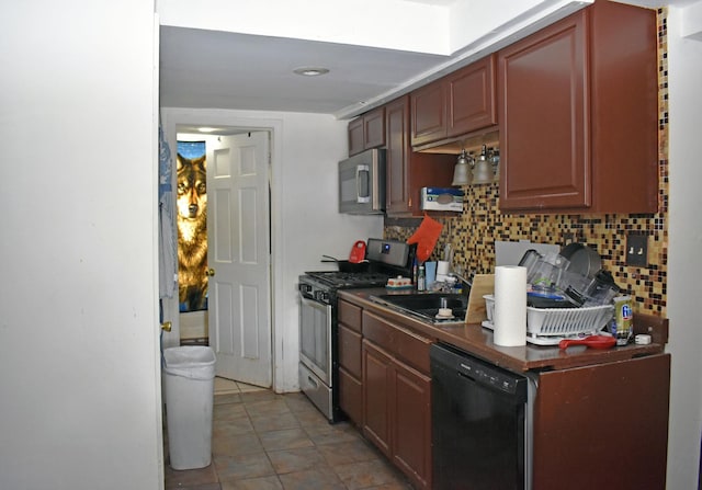 516 Clifton Dr, Round Lake Park, IL 60073 - kitchen featuring stainless steel appliances, decorative backsplash, light tile patterned flooring, and dark countertops
