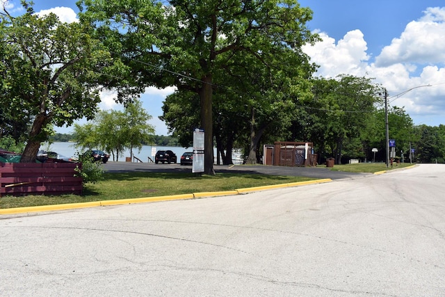 516 Clifton Dr, Round Lake Park, IL 60073 - view of asphalt street with curbs and street lights