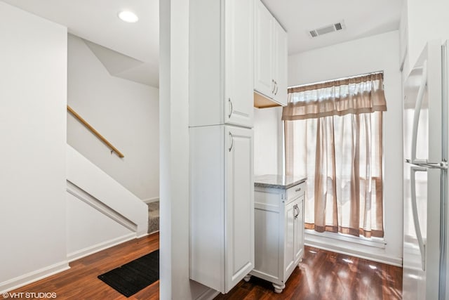 5916 Meadow Dr Unit 149-A, Lisle, IL 60532 - kitchen featuring freestanding refrigerator, dark wood finished floors, white cabinetry, light stone countertops, and recessed lighting