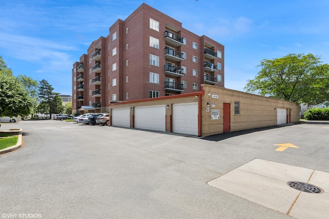 1470 Jefferson St Unit 602, Des Plaines, IL 60016 - view of apartment building / complex featuring community garages