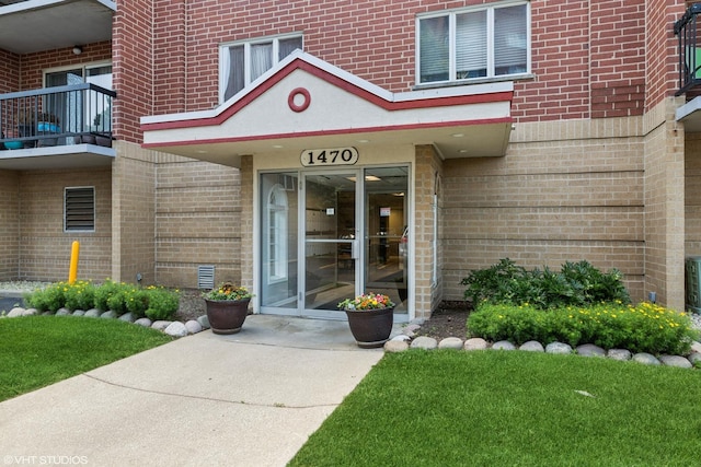 1470 Jefferson St Unit 602, Des Plaines, IL 60016 - doorway to property with brick siding and a balcony