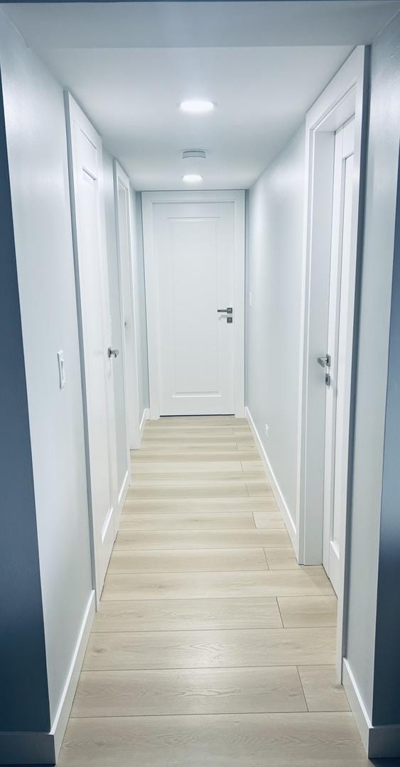 1470 Jefferson St Unit 602, Des Plaines, IL 60016 - hallway with baseboards and light wood-type flooring