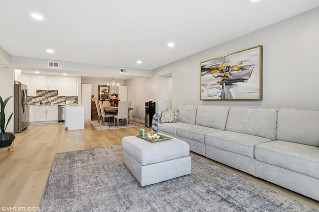 1470 Jefferson St Unit 602, Des Plaines, IL 60016 - living room with light wood-style floors, recessed lighting, and a chandelier