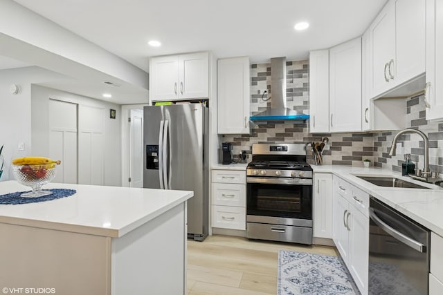 1470 Jefferson St Unit 602, Des Plaines, IL 60016 - kitchen with stainless steel appliances, wall chimney range hood, backsplash, light wood finished floors, and white cabinetry