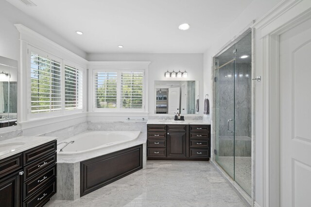 2115 Washington Ave, Wilmette, IL 60091 - bathroom with two vanities, a bath, a shower stall, marble tiled flooring, and recessed lighting