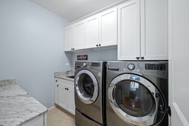 2115 Washington Ave, Wilmette, IL 60091 - washroom featuring cabinet space, independent washer and dryer, and light tile patterned floors