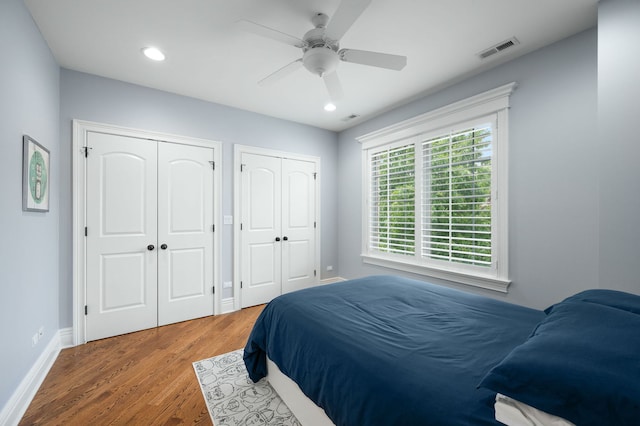 2115 Washington Ave, Wilmette, IL 60091 - bedroom with two closets, wood finished floors, recessed lighting, and a ceiling fan