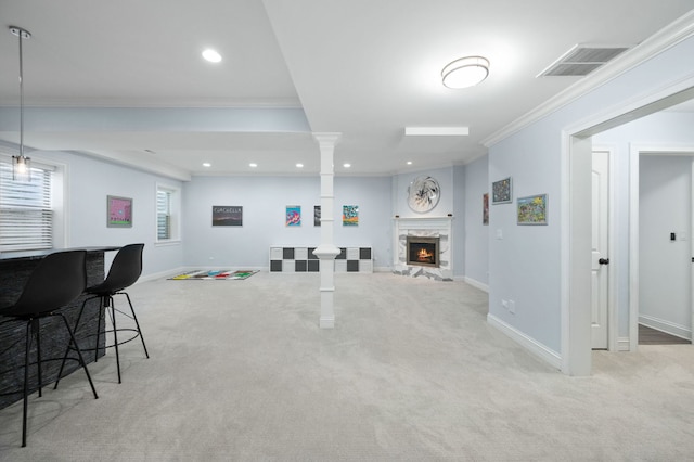 2115 Washington Ave, Wilmette, IL 60091 - carpeted living room featuring ornate columns, ornamental molding, recessed lighting, and a fireplace