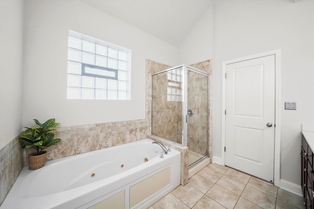 4809 S Wabash Ave Unit 3, Chicago, IL 60615 - full bathroom with a tub with jets, a shower stall, vanity, lofted ceiling, and tile patterned flooring