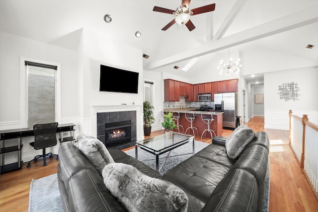 4809 S Wabash Ave Unit 3, Chicago, IL 60615 - living area featuring a ceiling fan, light wood-style floors, a tile fireplace, a chandelier, and recessed lighting