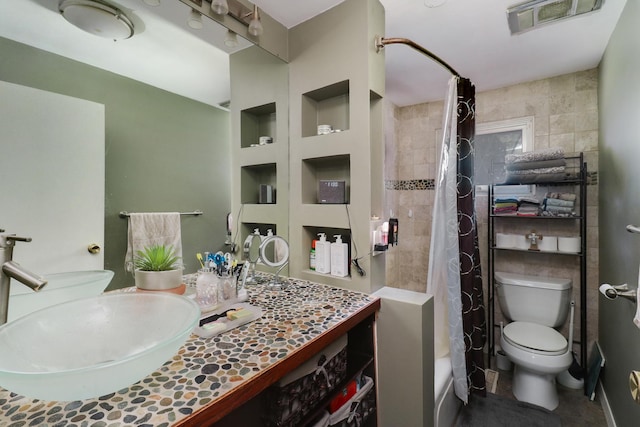325 W Poplar St S, Heyworth, IL 61745 - bathroom featuring vanity, built in shelves, and shower / bathtub combination with curtain