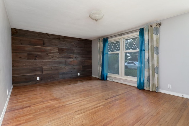 325 W Poplar St S, Heyworth, IL 61745 - spare room with light wood-style floors and wooden walls