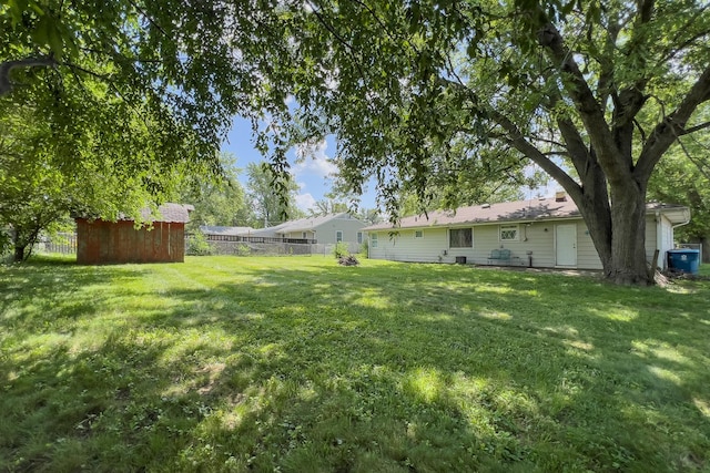 325 W Poplar St S, Heyworth, IL 61745 - fenced backyard featuring a storage shed