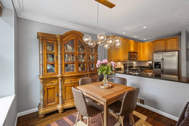 4026 N Clarendon Ave Unit 2N, Chicago, IL 60613 - dining area featuring a chandelier, ornamental molding, recessed lighting, and dark wood-style flooring
