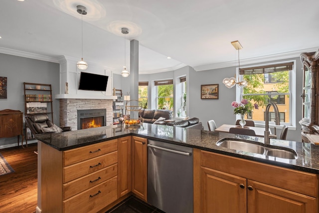 4026 N Clarendon Ave Unit 2N, Chicago, IL 60613 - kitchen with stainless steel dishwasher, open floor plan, crown molding, dark stone countertops, and brown cabinets