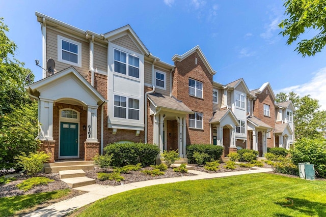 6163 Mayfair St, Morton Grove, IL 60053 - view of property featuring brick siding, a front lawn, and a residential view