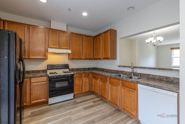 6163 Mayfair St, Morton Grove, IL 60053 - kitchen with dishwasher, black fridge with ice dispenser, range with gas stovetop, under cabinet range hood, and dark countertops