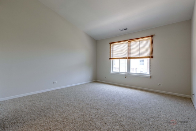 6163 Mayfair St, Morton Grove, IL 60053 - unfurnished room with light colored carpet and vaulted ceiling