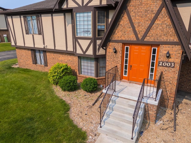 2003 Tracy Dr Unit 1, Bloomington, IL 61704 - view of front of property featuring brick siding and a front yard