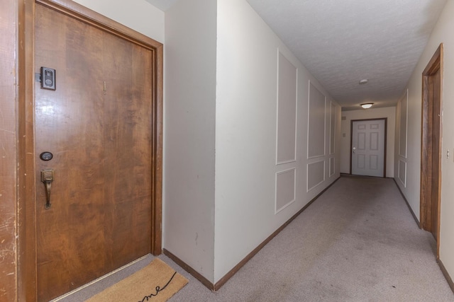 2003 Tracy Dr Unit 1, Bloomington, IL 61704 - hallway featuring light colored carpet and baseboards