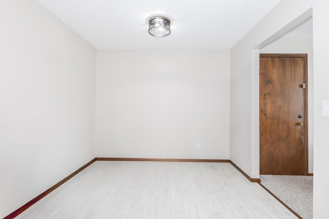 2003 Tracy Dr Unit 1, Bloomington, IL 61704 - spare room featuring light wood-style floors and baseboards