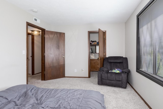 2003 Tracy Dr Unit 1, Bloomington, IL 61704 - carpeted bedroom with baseboards