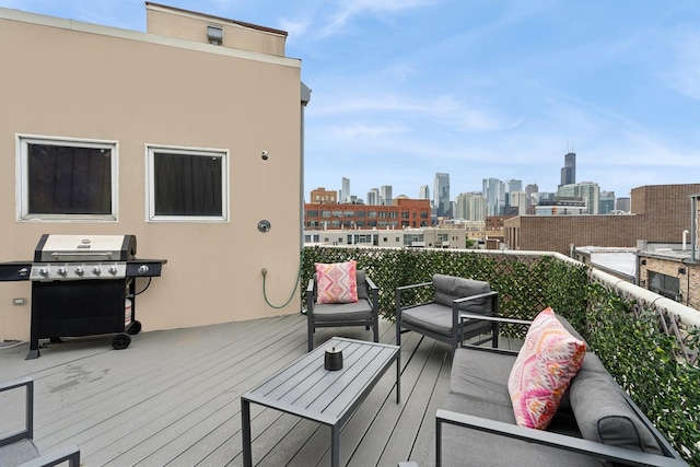 957 W Huron St Unit 2, Chicago, IL 60642 - wooden terrace with grilling area, a view of skyline, and an outdoor living space