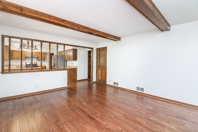 1718 Beloit Dr, Naperville, IL 60565 - unfurnished living room with beam ceiling and dark wood-type flooring