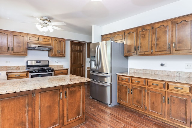 1718 Beloit Dr, Naperville, IL 60565 - kitchen with stainless steel appliances, under cabinet range hood, ceiling fan, dark wood-style floors, and light stone countertops