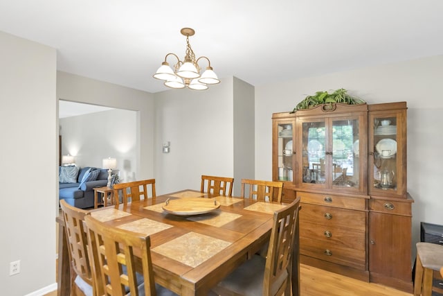 93 Faringdon Dr, Crystal Lake, IL 60014 - dining room featuring light wood finished floors and a chandelier