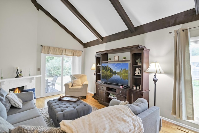 93 Faringdon Dr, Crystal Lake, IL 60014 - living room with high vaulted ceiling, beam ceiling, light wood finished floors, and a brick fireplace